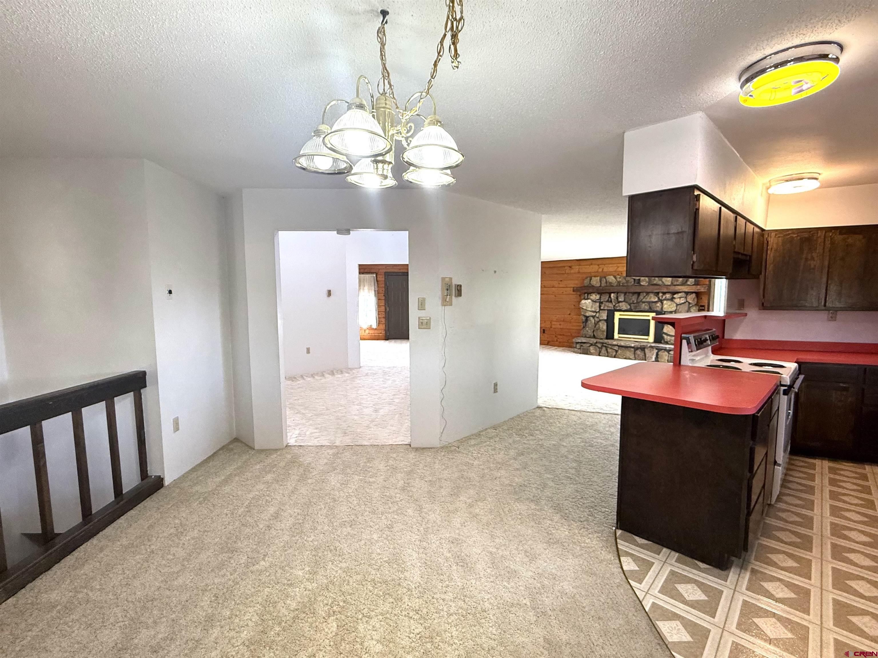 24816 Rd M.3 Cortez, CO 81321 - Photo 18 of 34 a view of kitchen with a sink dishwasher and a flat screen tv