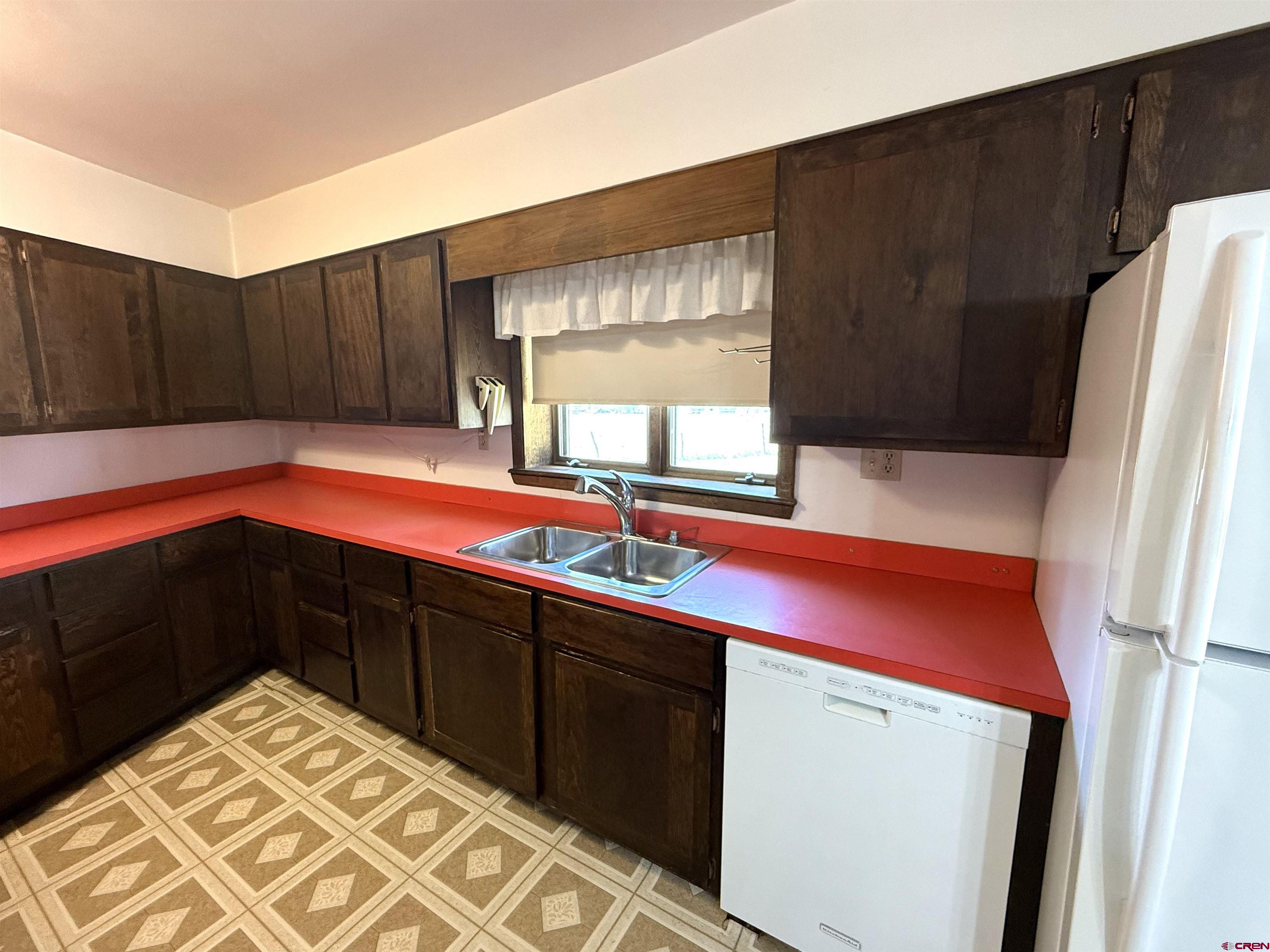 24816 Rd M.3 Cortez, CO 81321 - Photo 19 of 34 a kitchen with stainless steel appliances a refrigerator and sink