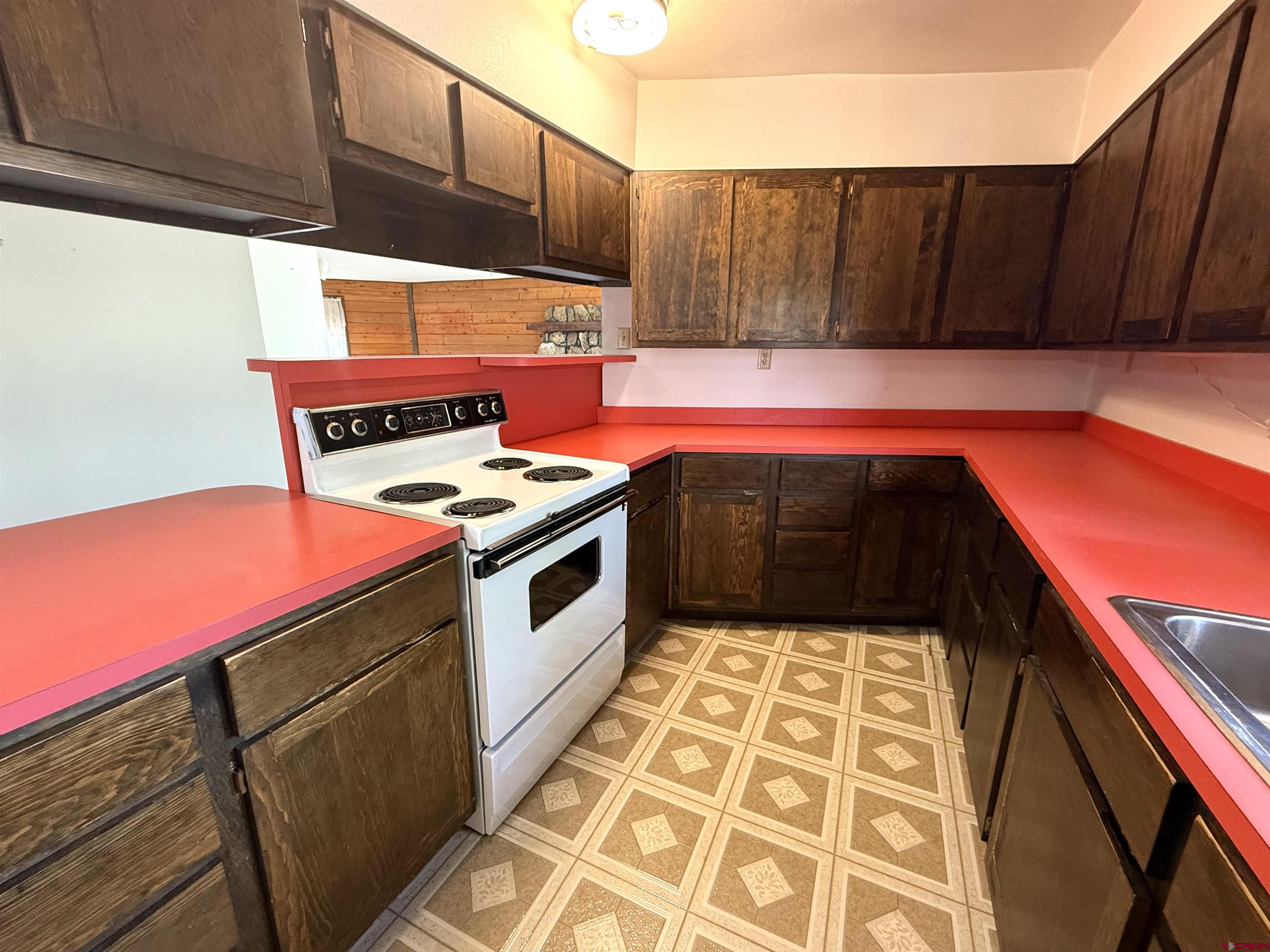 24816 Rd M.3 Cortez, CO 81321 - Photo 20 of 34 a kitchen with stainless steel appliances a stove a sink and dishwasher