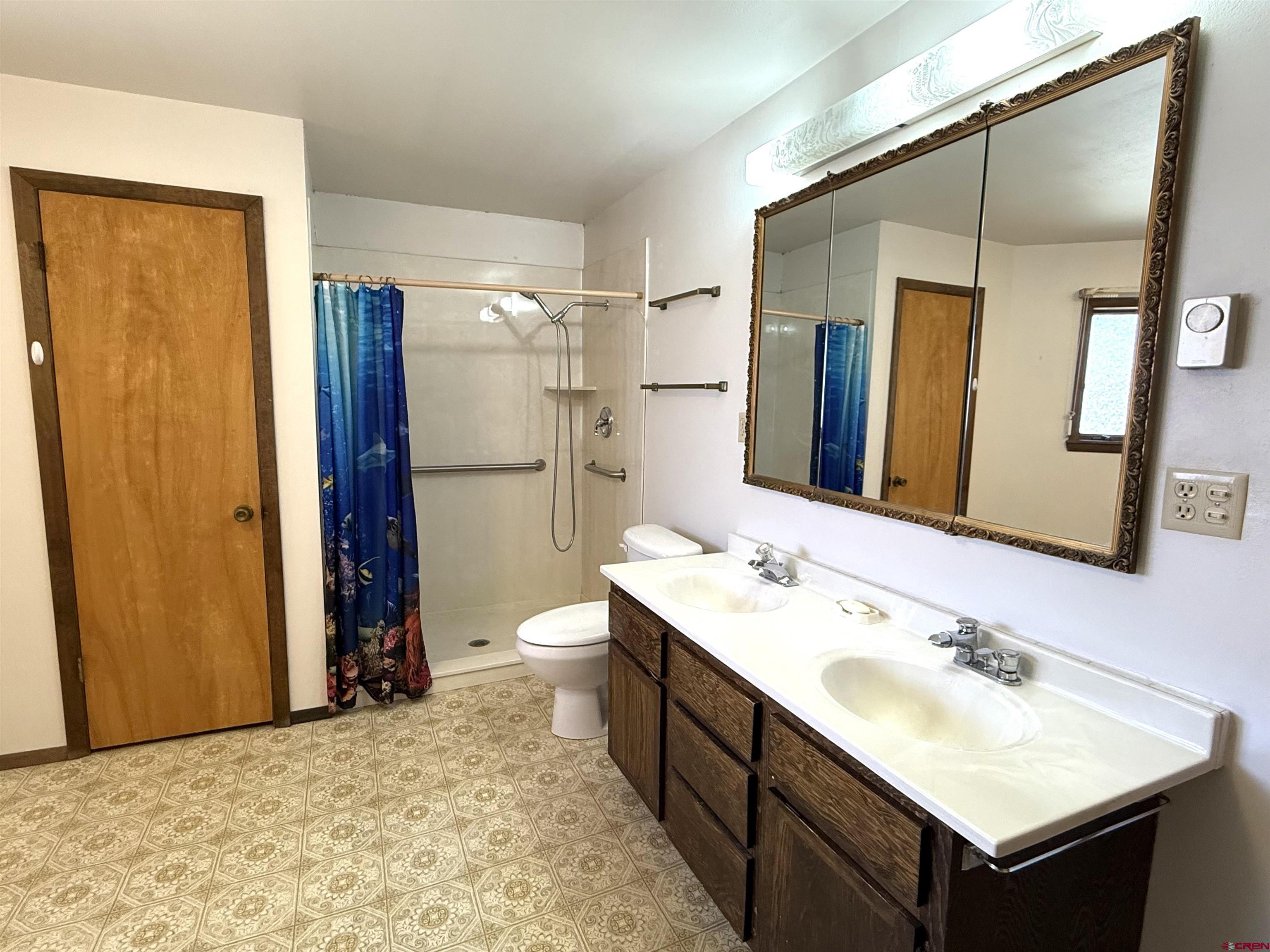 24816 Rd M.3 Cortez, CO 81321 - Photo 22 of 34 a bathroom with a sink and a mirror