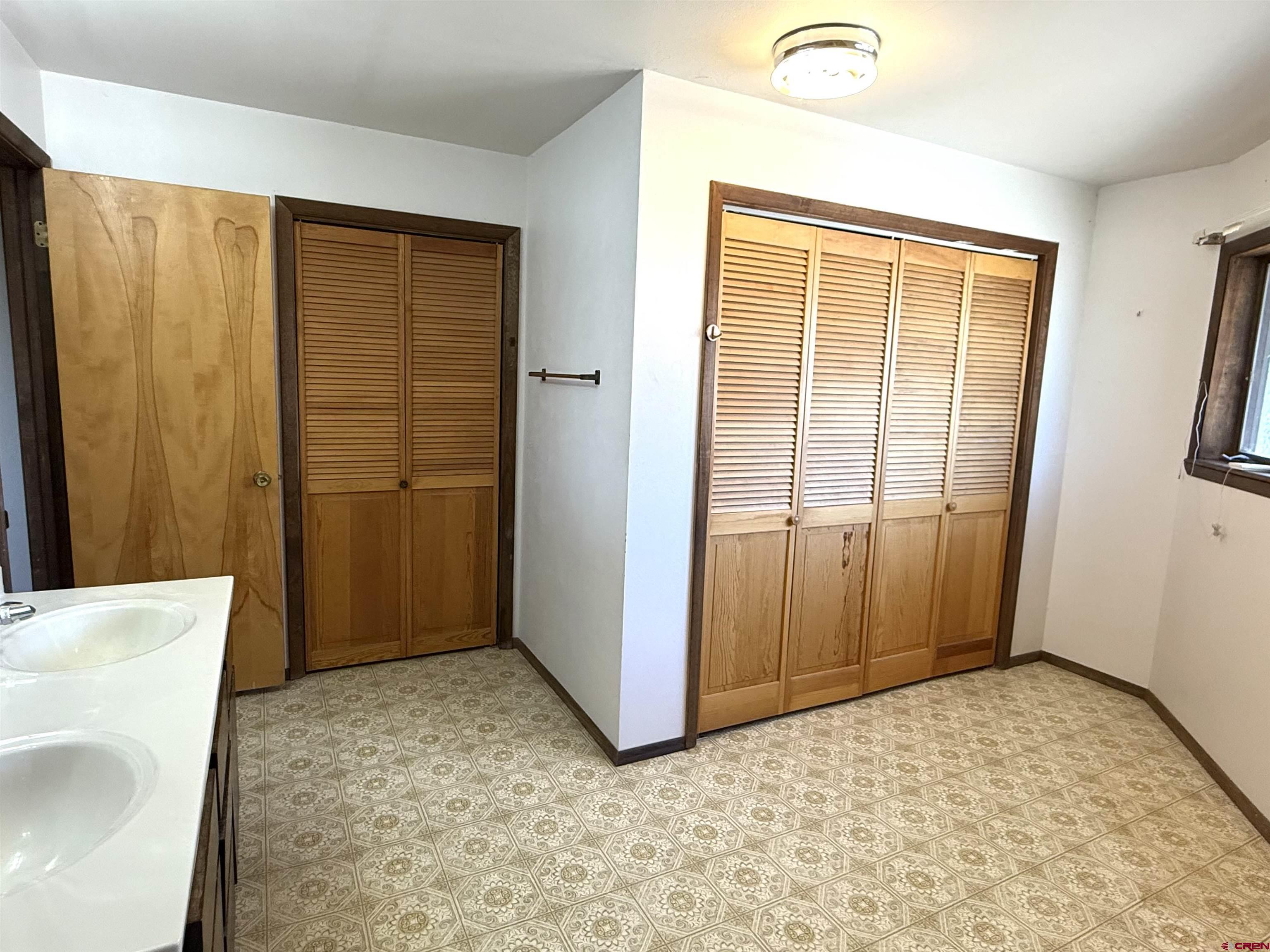 24816 Rd M.3 Cortez, CO 81321 - Photo 23 of 34 a view of an empty room with wooden door