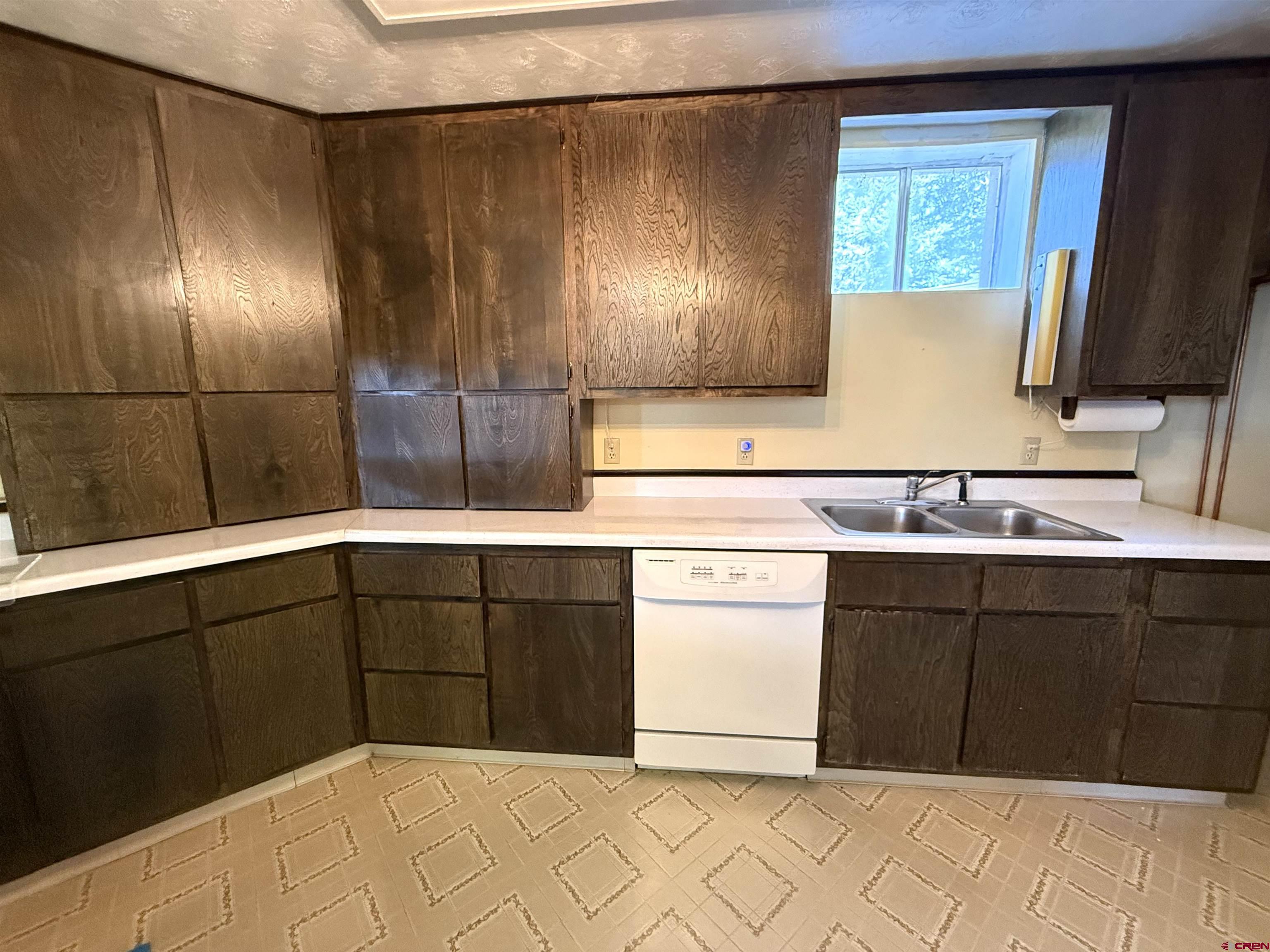 24816 Rd M.3 Cortez, CO 81321 - Photo 29 of 34 a kitchen with a sink and cabinets