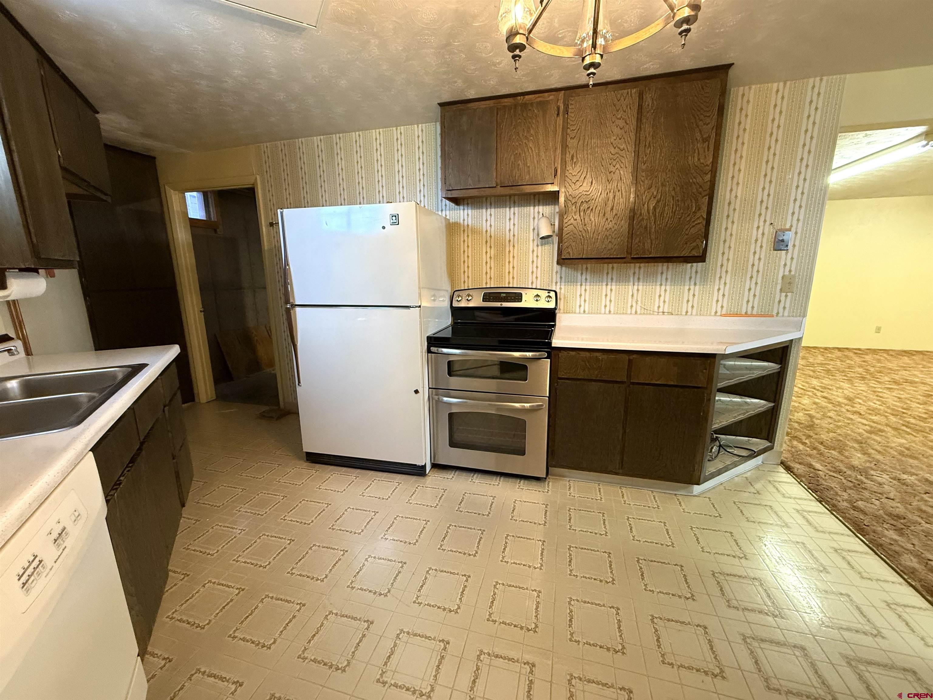 24816 Rd M.3 Cortez, CO 81321 - Photo 30 of 34 a kitchen with stainless steel appliances a stove a sink and a refrigerator