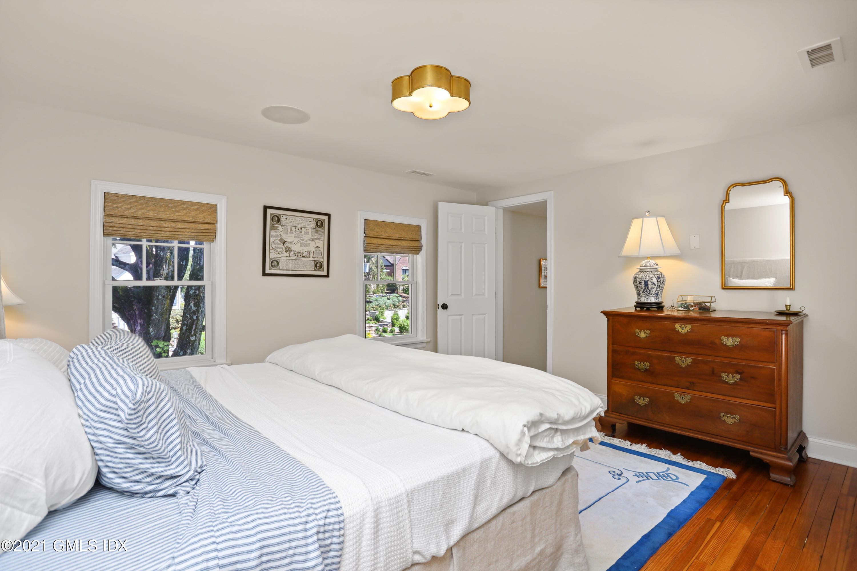 20 Ridge Road Cos Cob, CT 06807 - Photo 16 of 31 a bedroom with a bed and a dresser