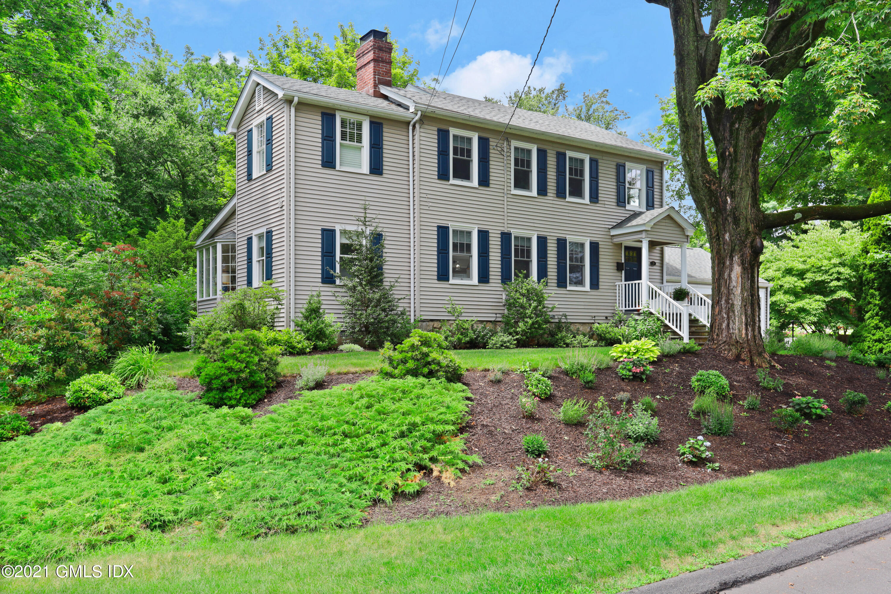 20 Ridge Road Cos Cob, CT 06807 - Photo 2 of 31 a front view of a house with garden