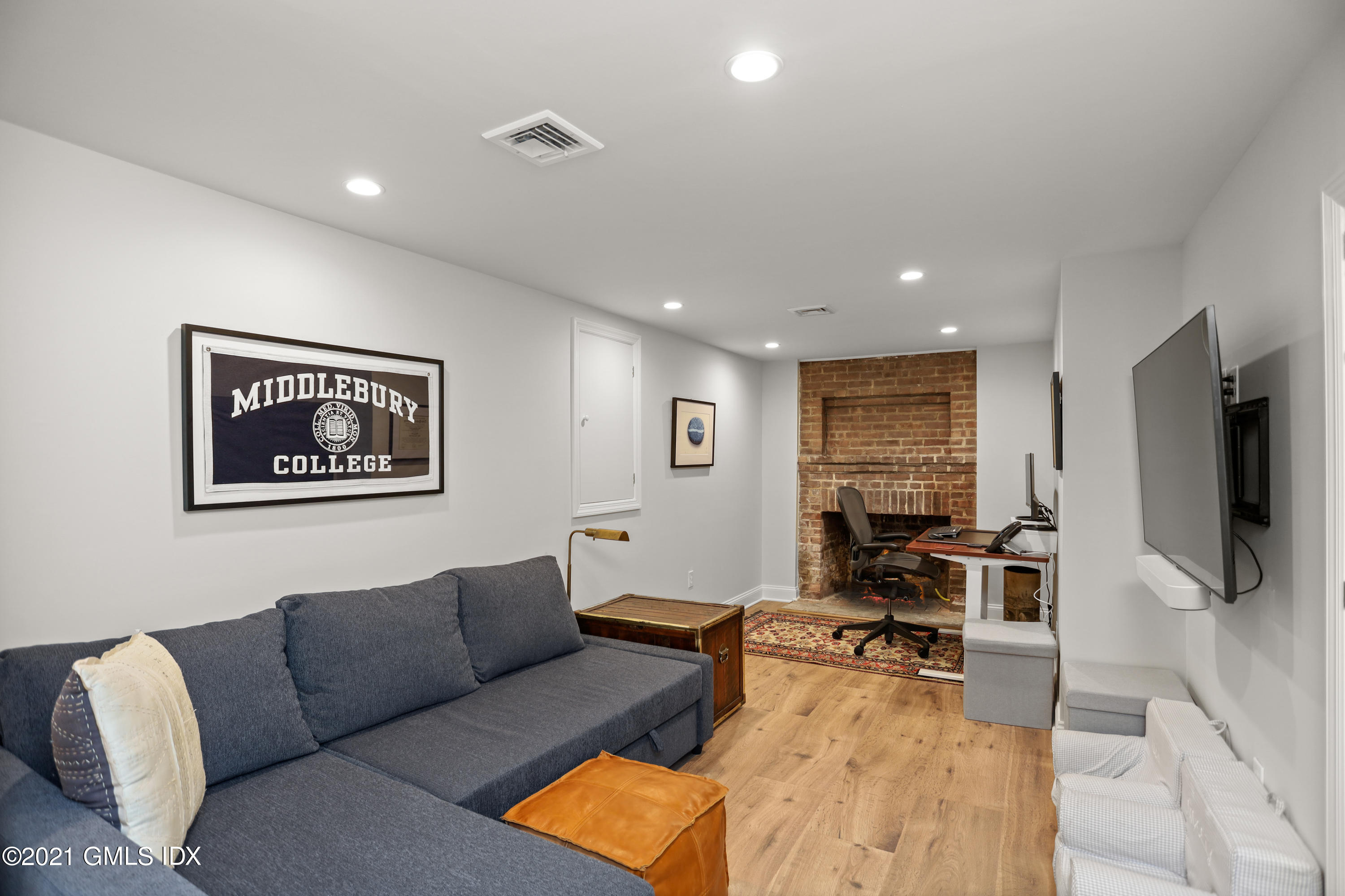 20 Ridge Road Cos Cob, CT 06807 - Photo 23 of 31 a living room with furniture and a flat screen tv