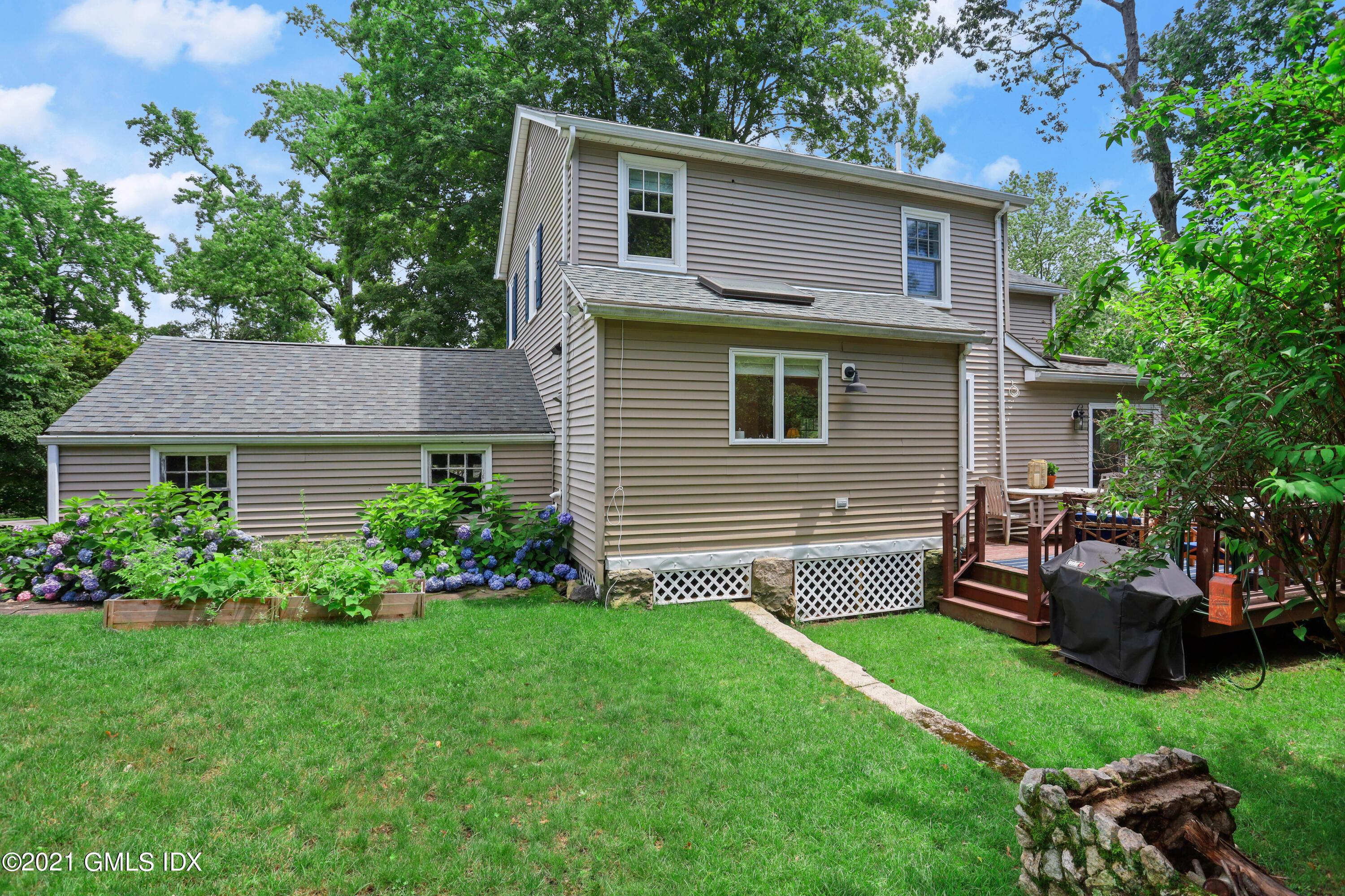 20 Ridge Road Cos Cob, CT 06807 - Photo 28 of 31 a front view of a house with a garden