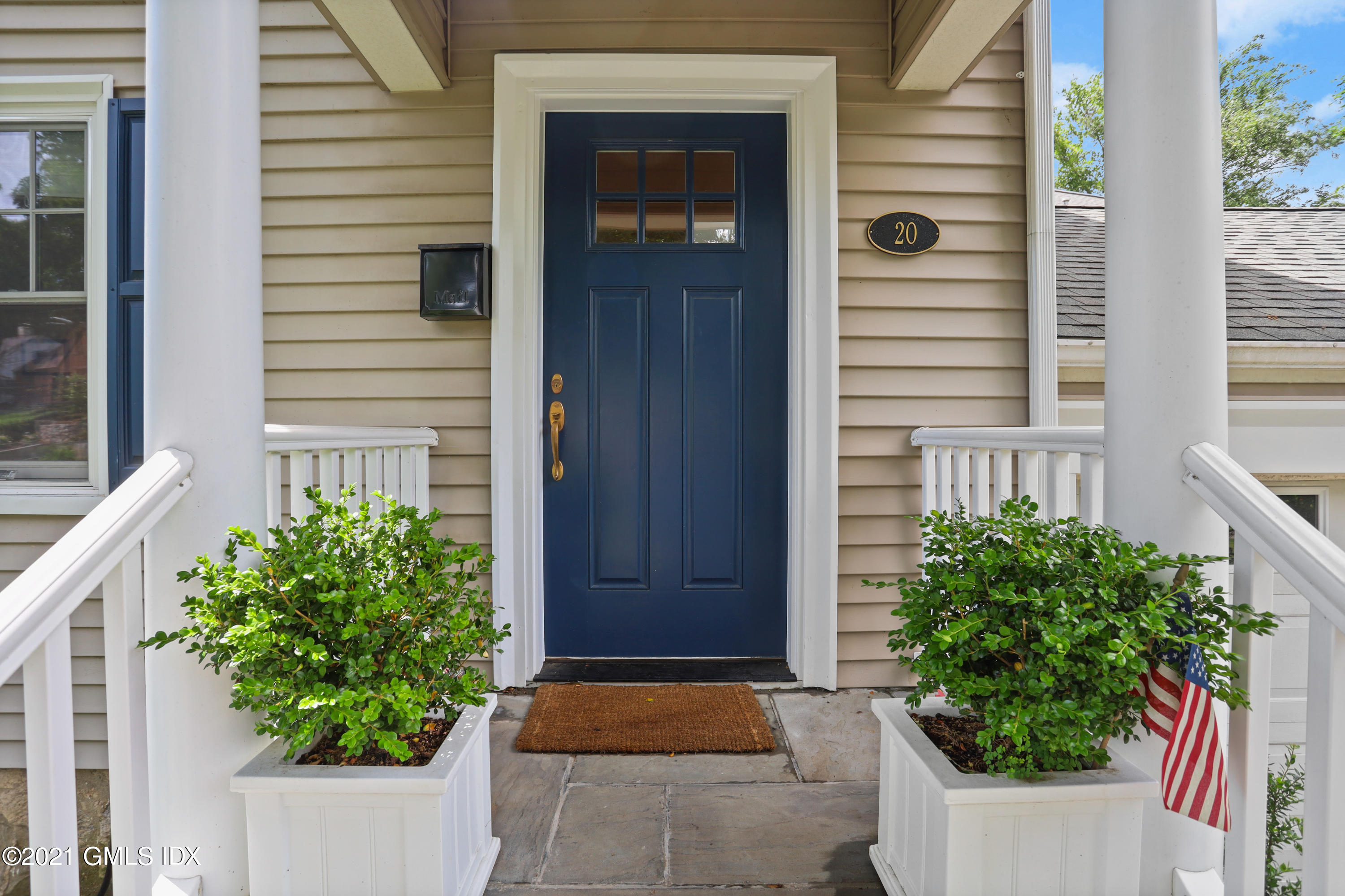 20 Ridge Road Cos Cob, CT 06807 - Photo 3 of 31 a front view of a house with a yard