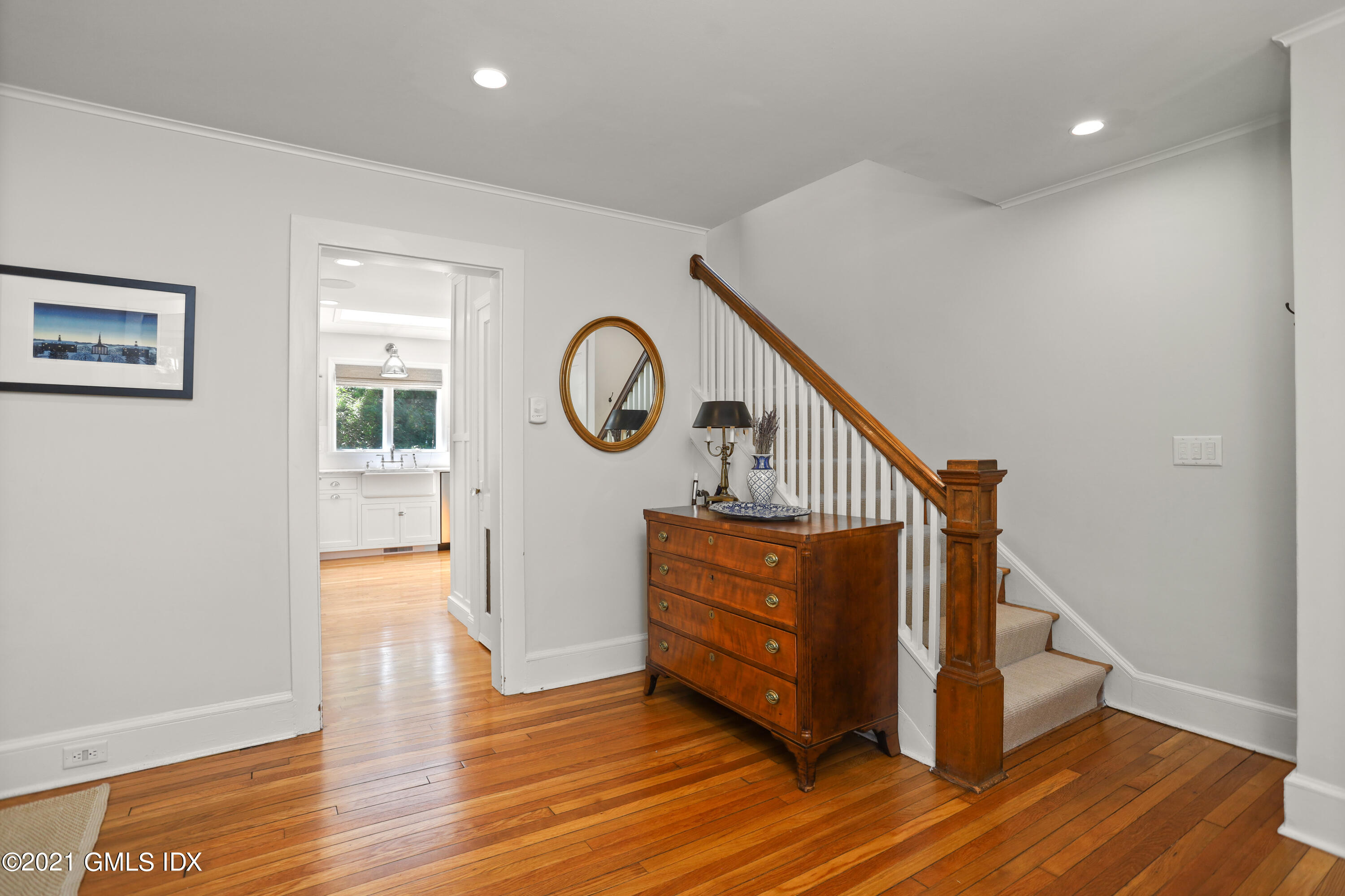 20 Ridge Road Cos Cob, CT 06807 - Photo 4 of 31 a view of a hallway with wooden floor and a large window