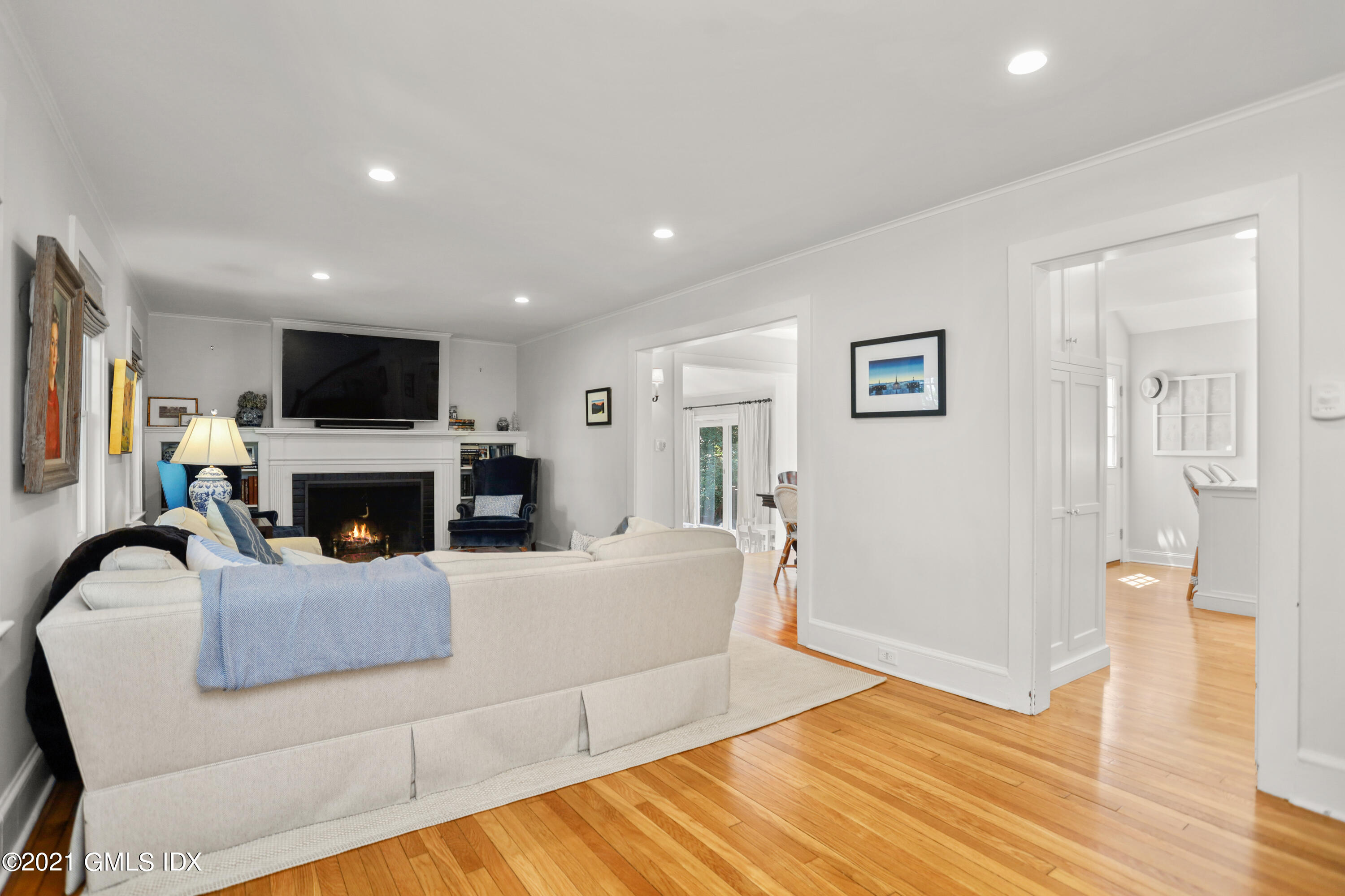 20 Ridge Road Cos Cob, CT 06807 - Photo 5 of 31 a living room with furniture a fireplace and a flat screen tv