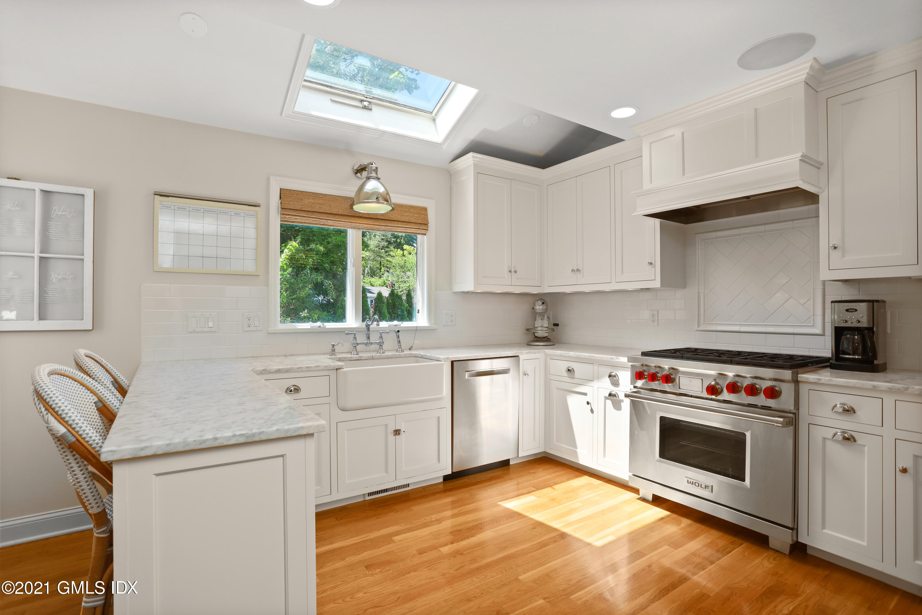 20 Ridge Road Cos Cob, CT 06807 - Photo 8 of 31 a kitchen with a stove a sink and a window