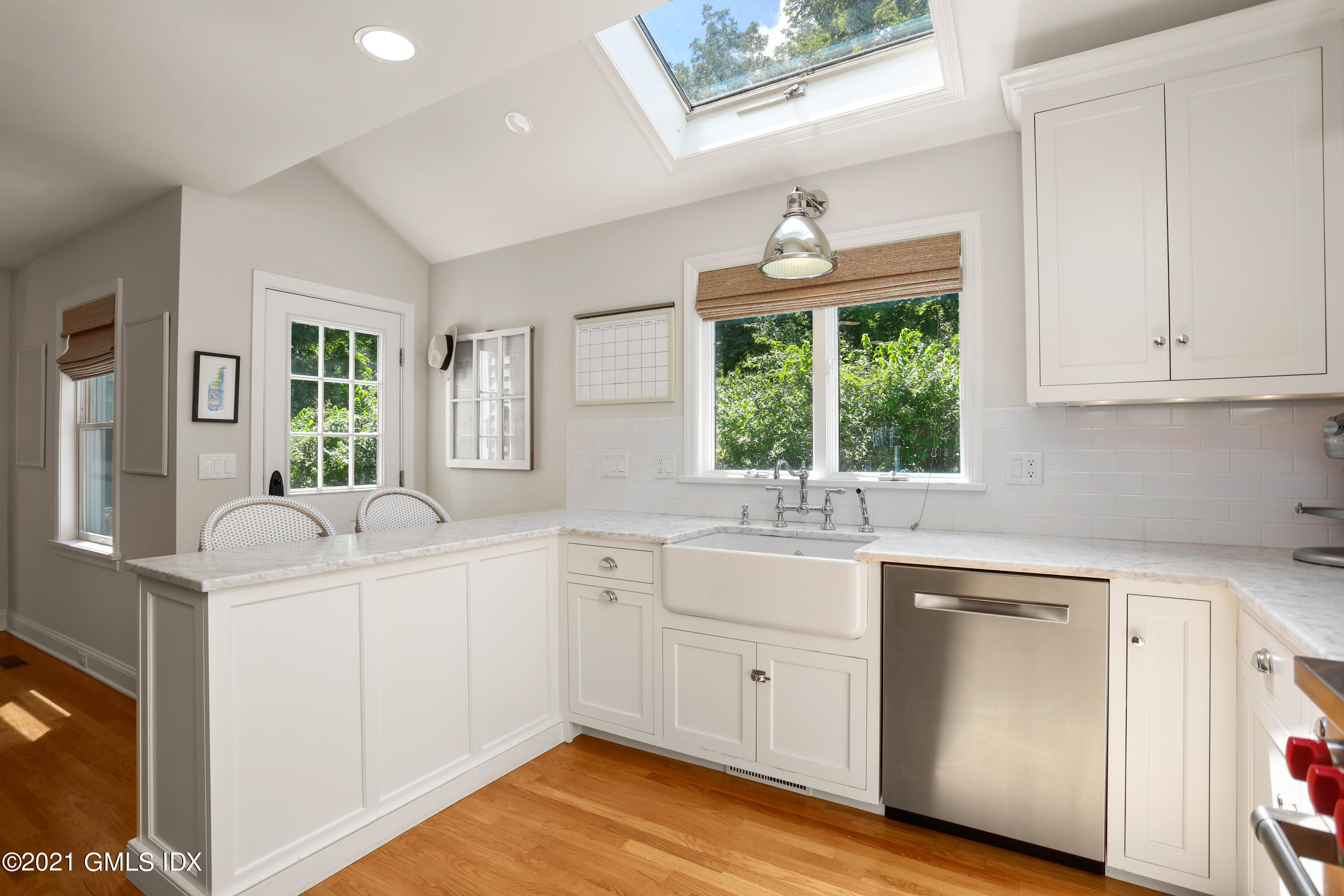 20 Ridge Road Cos Cob, CT 06807 - Photo 10 of 31 a kitchen with a sink cabinets and window