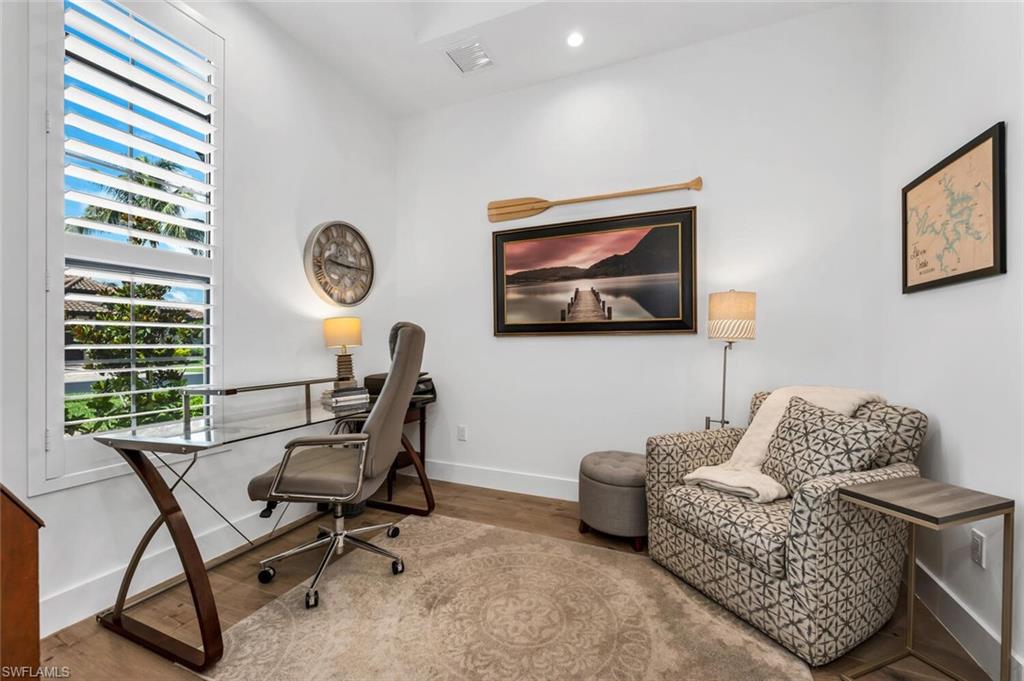 7437 Acorn Way Naples, FL 34119 - Photo 13 of 19 a living room with furniture and a window