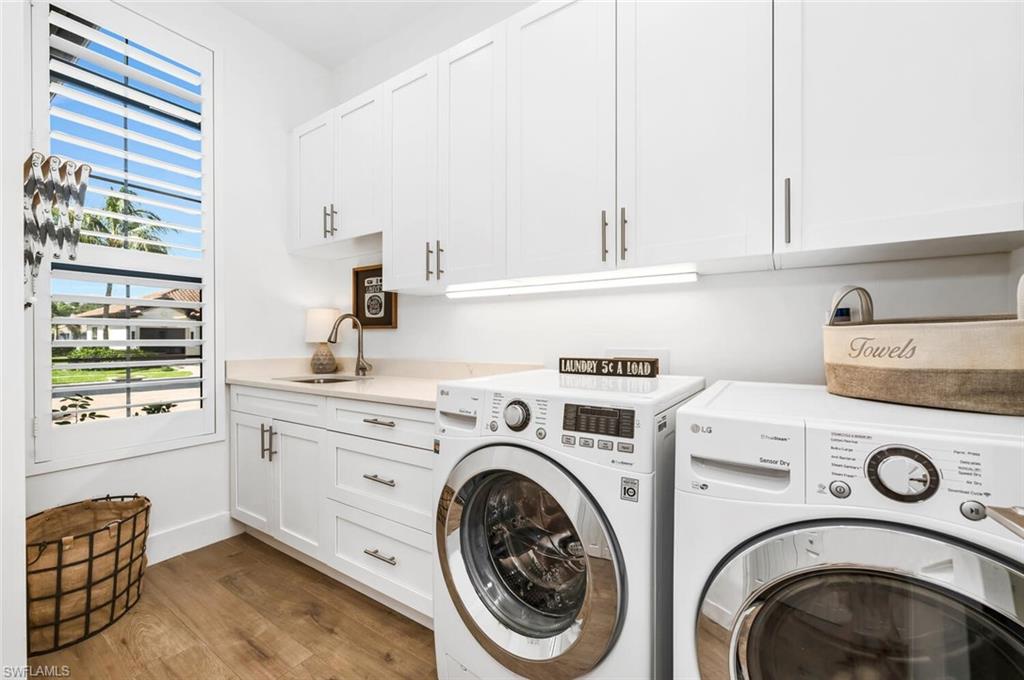 7437 Acorn Way Naples, FL 34119 - Photo 14 of 19 a utility room with dryer and washer