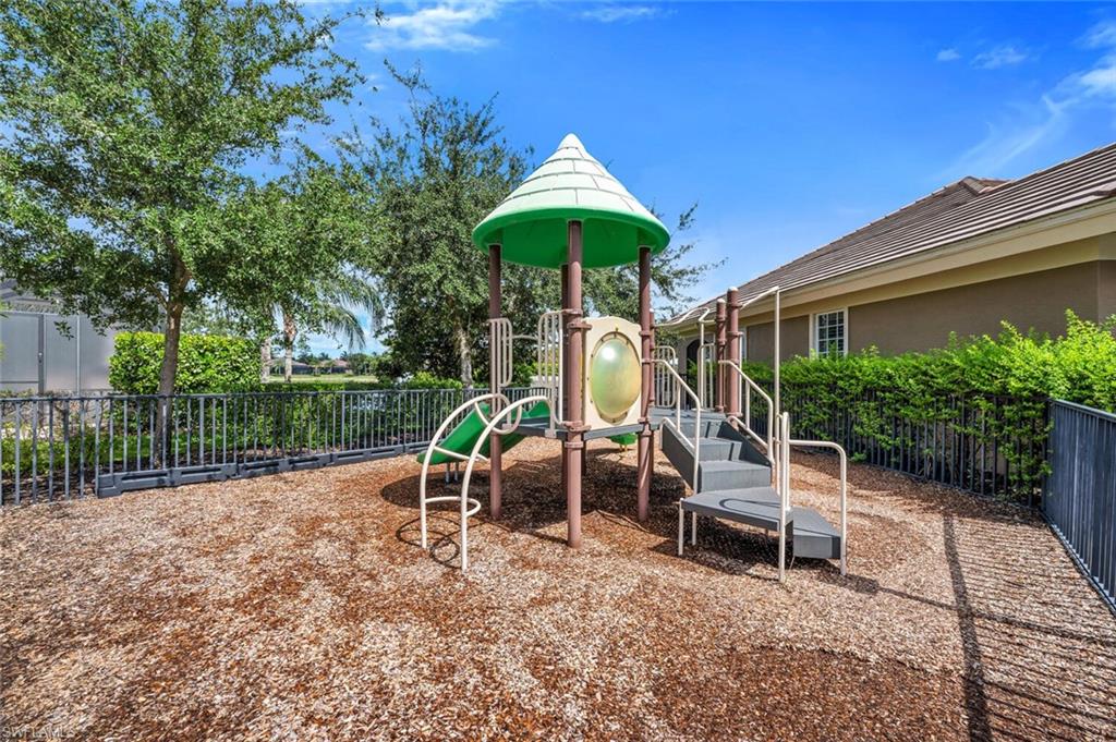 7437 Acorn Way Naples, FL 34119 - Photo 19 of 19 a view of a chair and table in backyard of the house