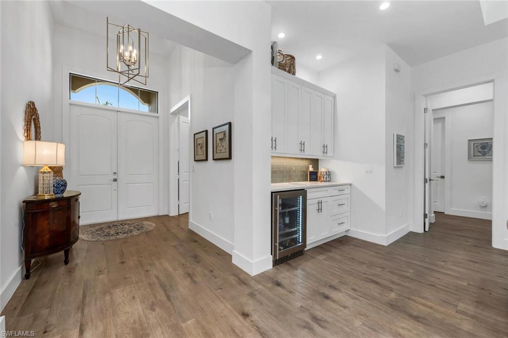 7437 Acorn Way Naples, FL 34119 - Photo 6 of 19 a view of kitchen with wooden floor