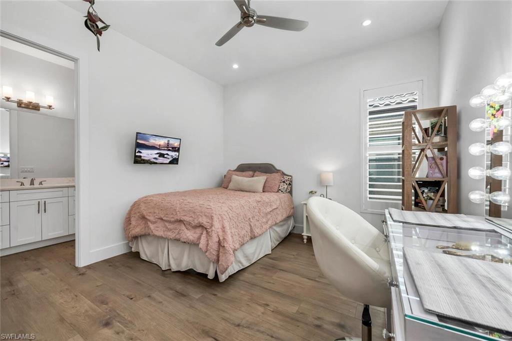 7437 Acorn Way Naples, FL 34119 - Photo 9 of 19 a bedroom with a bed and window