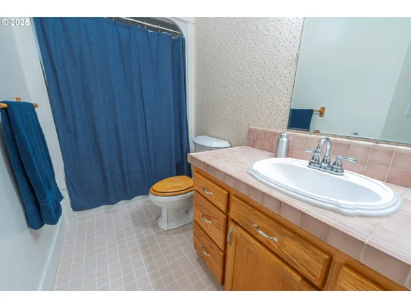 a bedroom with a bed and a tv in it