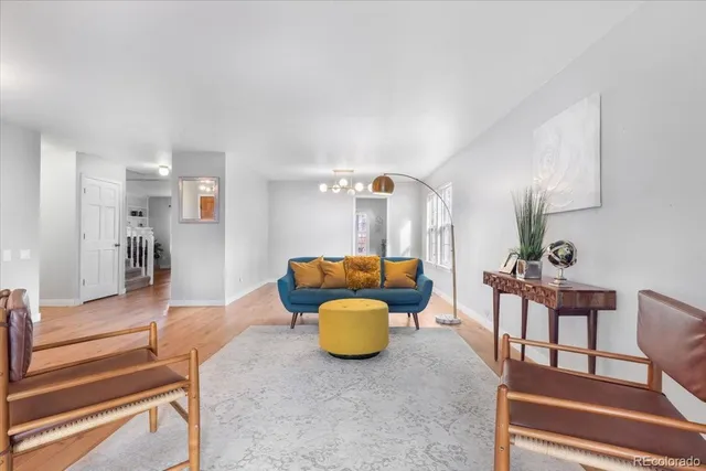 a living room with furniture and a table