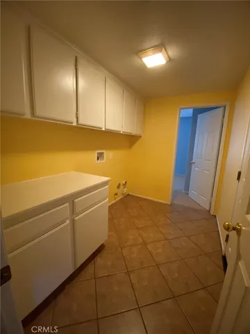 a room with a sink and cabinets
