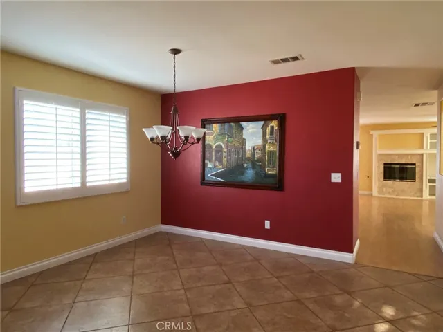 a view of a livingroom with an empty space and window