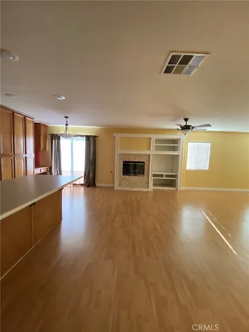 a view of a livingroom with wooden floor
