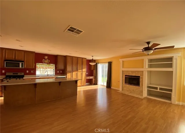a view of a kitchen with a sink oven cabinets and a kitchen
