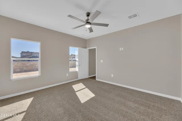 a spacious bathroom with a double vanity sink and a mirror
