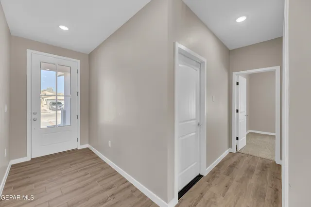 a bathroom with a toilet a sink a mirror and bathtub