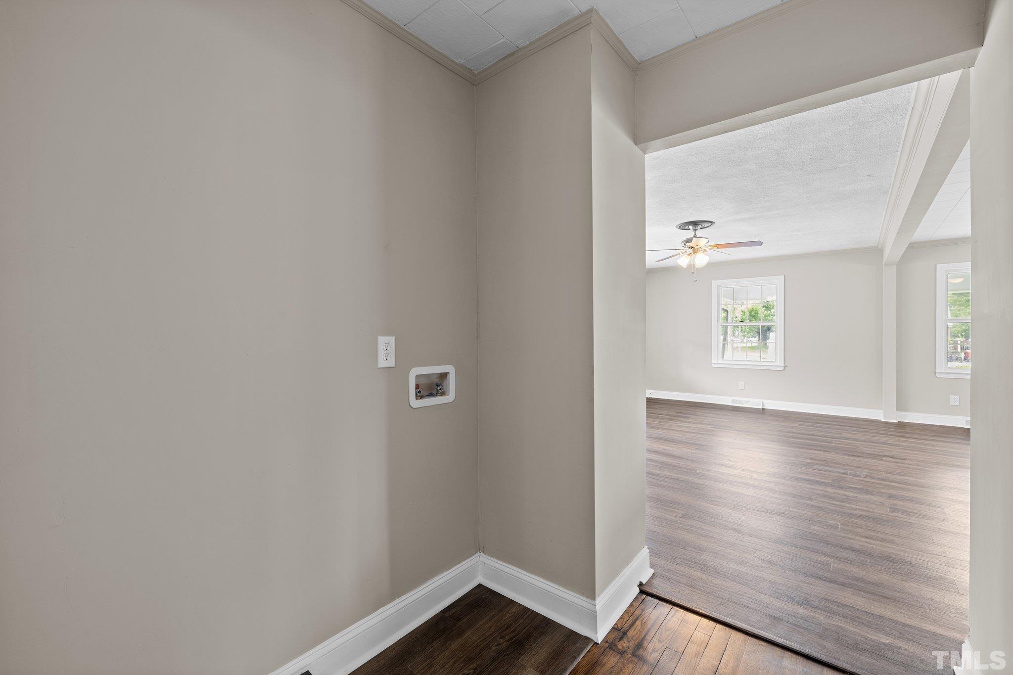 270 Burlington Road Roxboro, NC 27573 - Photo 20 of 37 a view of an empty room with wooden floor and a window