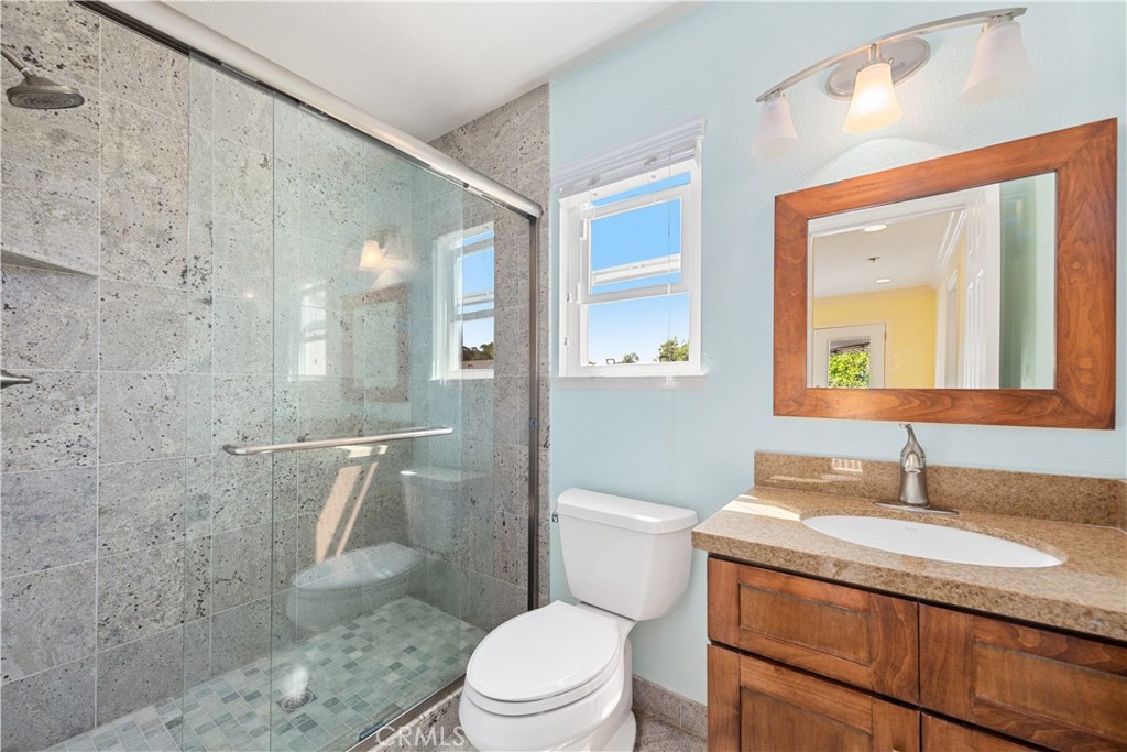 21236 Greenbrook Drive Walnut, CA 91789 - Photo 45 of 49 a bathroom with a granite countertop sink toilet and shower