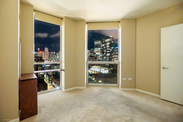 a view of a room with white walls and entryway