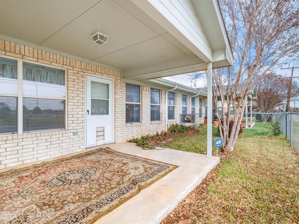 202 Abby Road Early, TX 76802 - Photo 27 of 28 a view of a big room with wooden fence and two windows