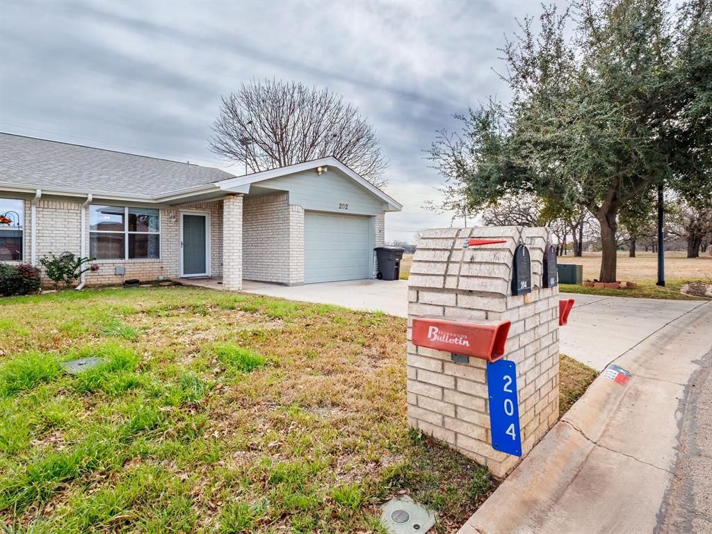 202 Abby Road Early, TX 76802 - Photo 4 of 28 a front view of a house with a yard