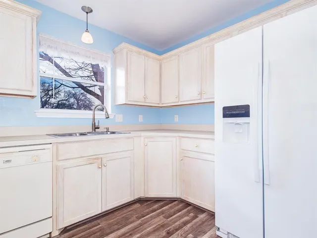 a view of cabinets with wooden floor