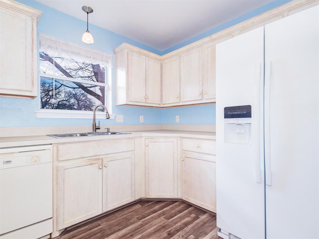202 Abby Road Early, TX 76802 - Photo 10 of 28 a view of cabinets with wooden floor