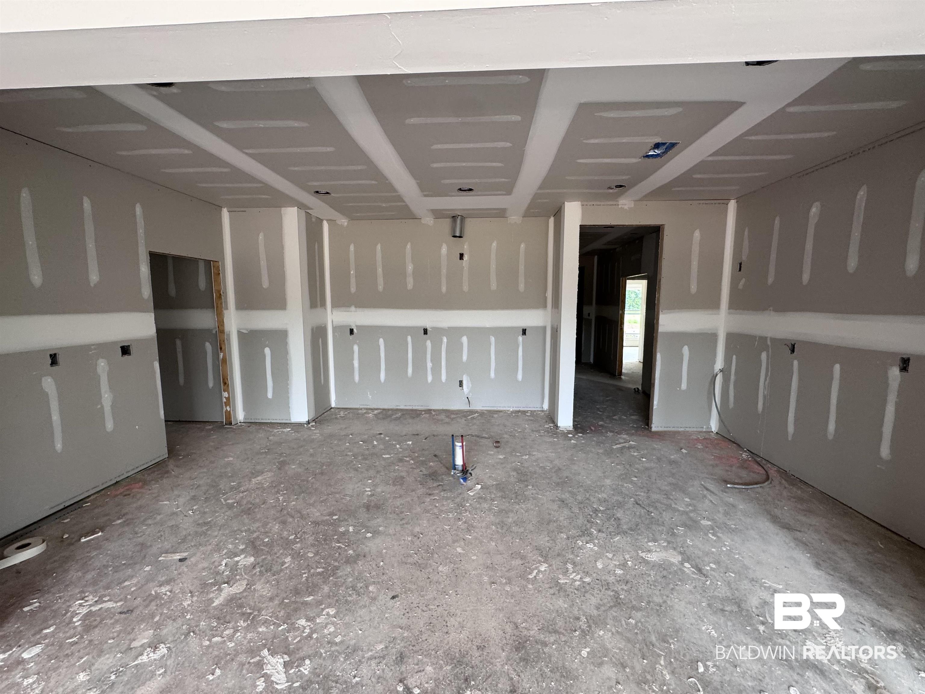 27355 Patch Pl Loop Daphne, AL 36526 - Photo 3 of 17 Open-concept interior featuring drywall installation, recessed ceiling sections, multiple wall outlets