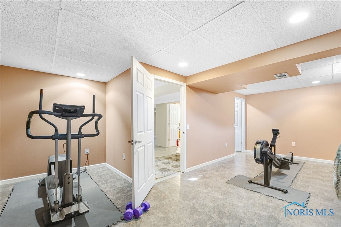 5841 Waterville Monclova Road Waterville, OH 43566 - Photo 32 of 39 There is a gym with a mounted tv, vinyl flooring and a storage closet.