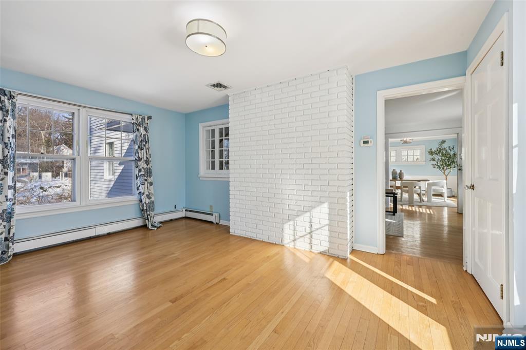 520 Hillcrest Road Ridgewood, NJ 07450 - Photo 13 of 27 a view of empty room with wooden floor and fan