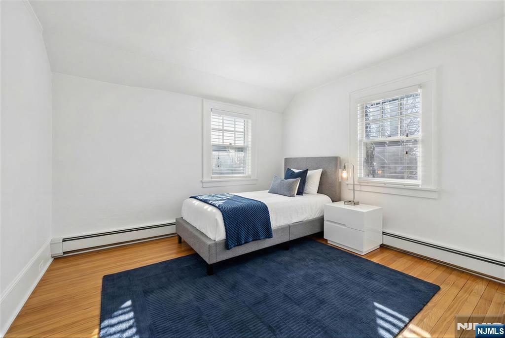 520 Hillcrest Road Ridgewood, NJ 07450 - Photo 19 of 27 a bedroom with a bed and window