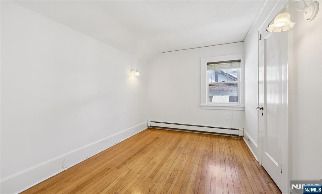 520 Hillcrest Road Ridgewood, NJ 07450 - Photo 22 of 27 a view of a big room with wooden floor and windows