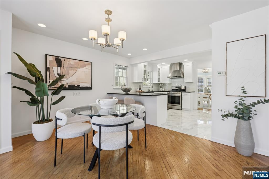 520 Hillcrest Road Ridgewood, NJ 07450 - Photo 8 of 27 a dining room filled chandelier and wooden floor