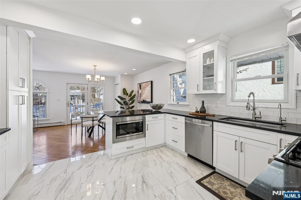 520 Hillcrest Road Ridgewood, NJ 07450 - Photo 9 of 27 a kitchen with lots of counter top space and appliances