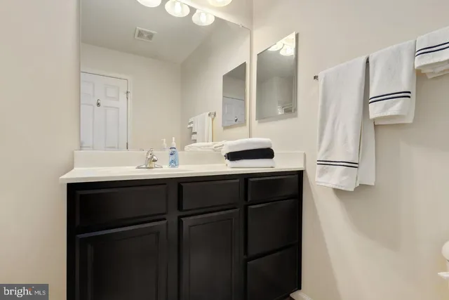 a kitchen with a sink and refrigerator