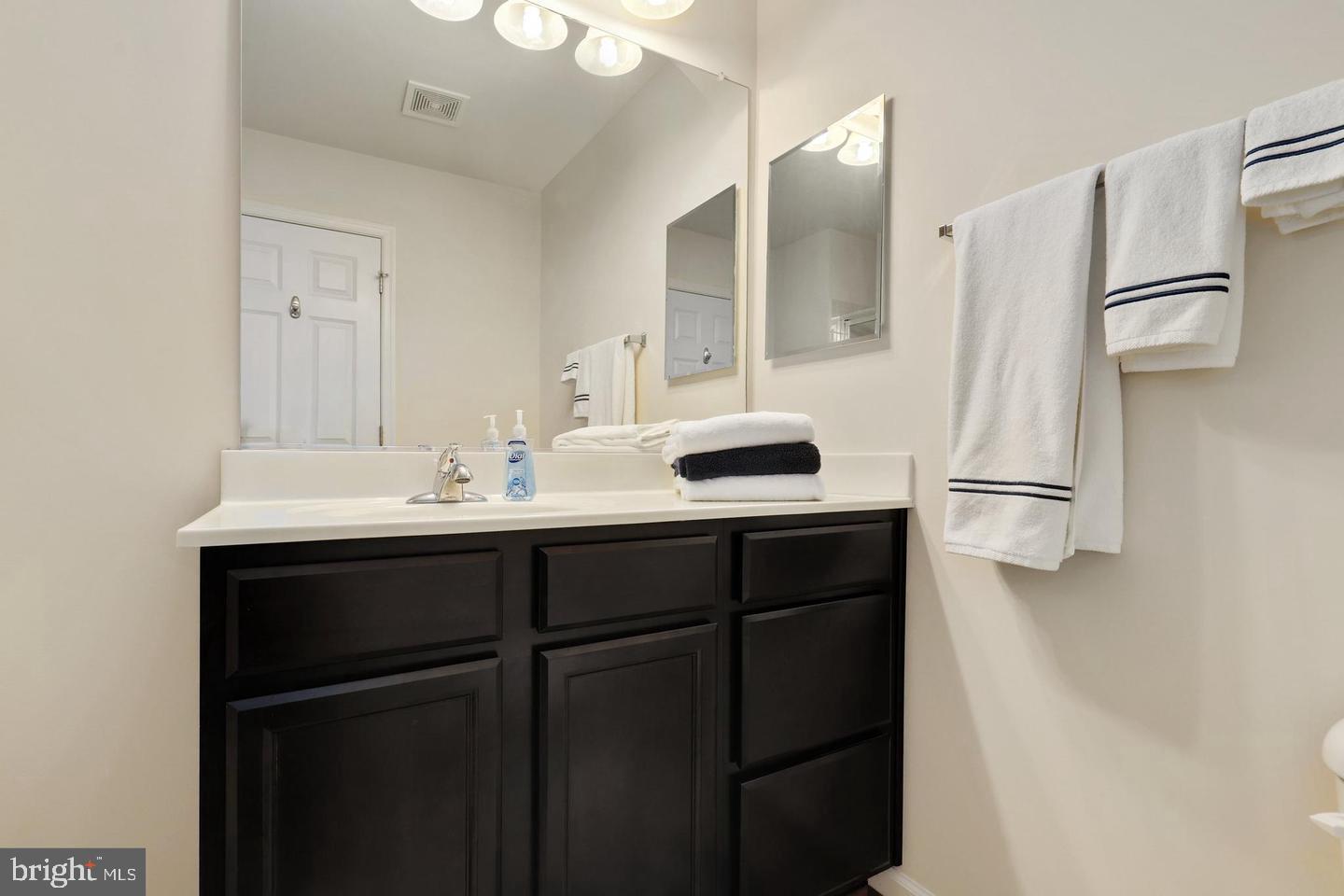 205 Woodstream Circle, Unit 2984 Stafford, VA 22556 - Photo 16 of 21 a kitchen with a sink and refrigerator