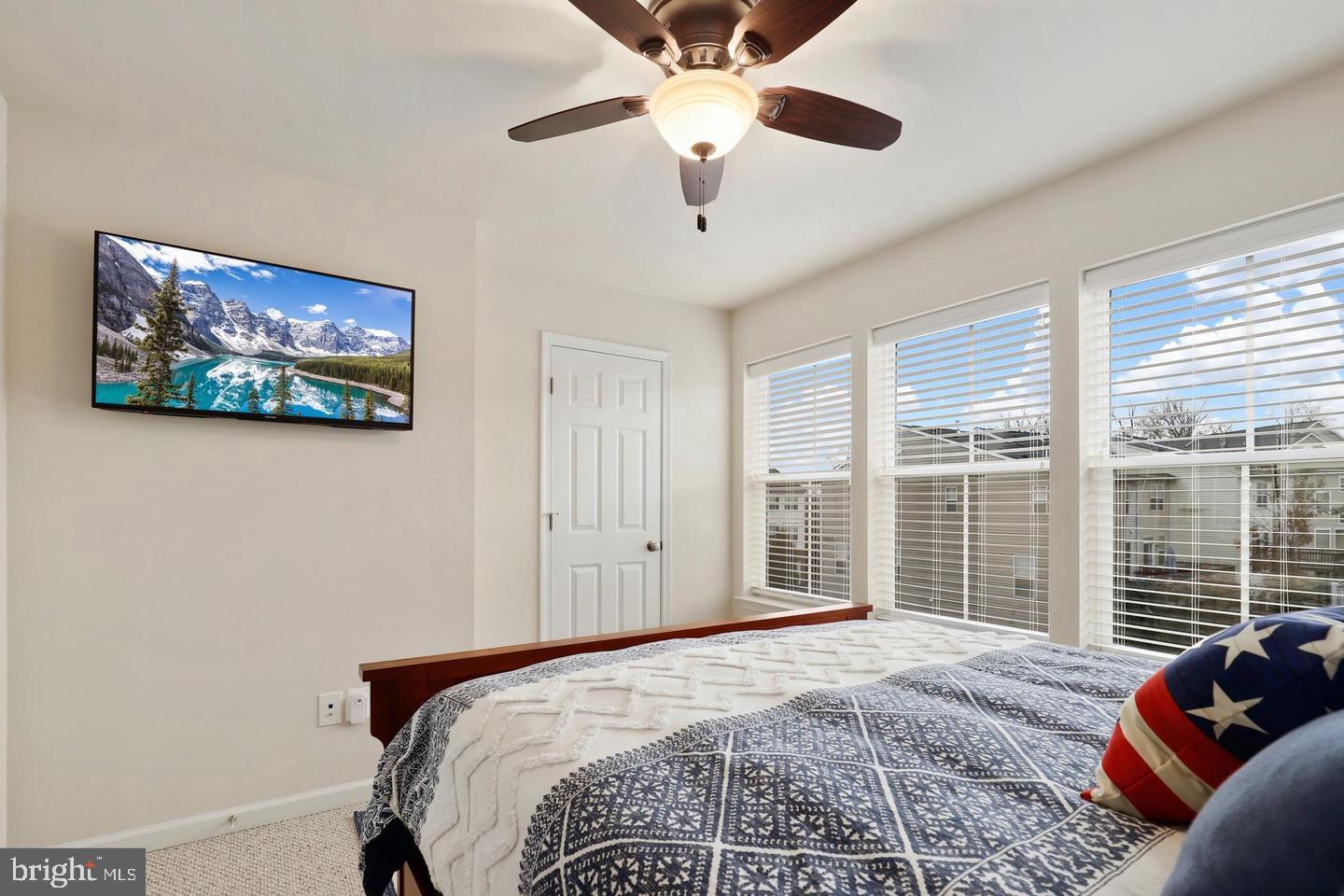 205 Woodstream Circle, Unit 2984 Stafford, VA 22556 - Photo 18 of 21 a bedroom with a large bed and a window