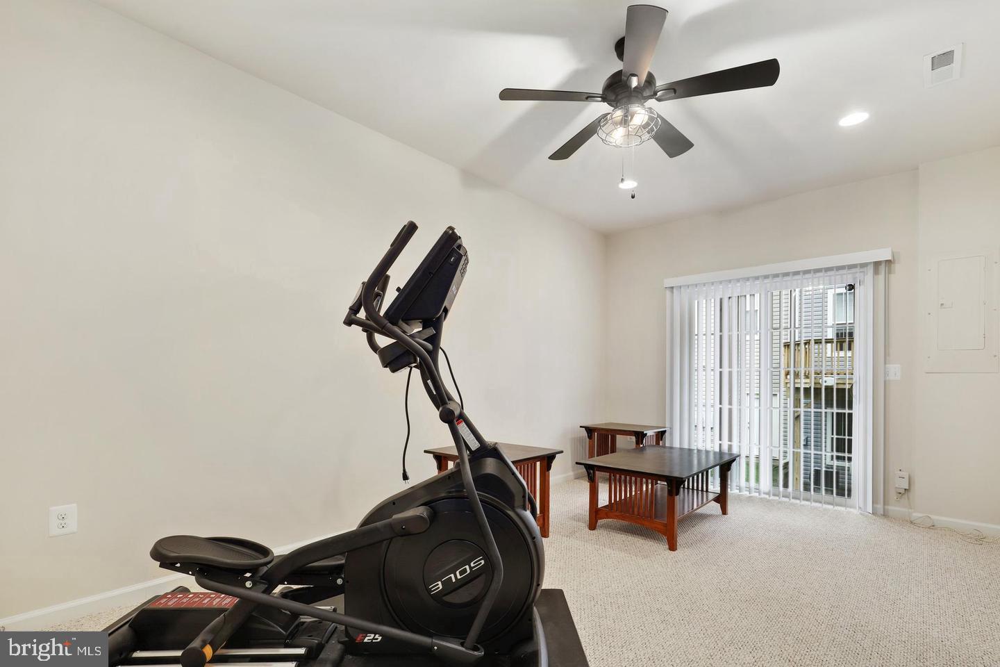 205 Woodstream Circle, Unit 2984 Stafford, VA 22556 - Photo 19 of 21 a room with gym equipment and windows