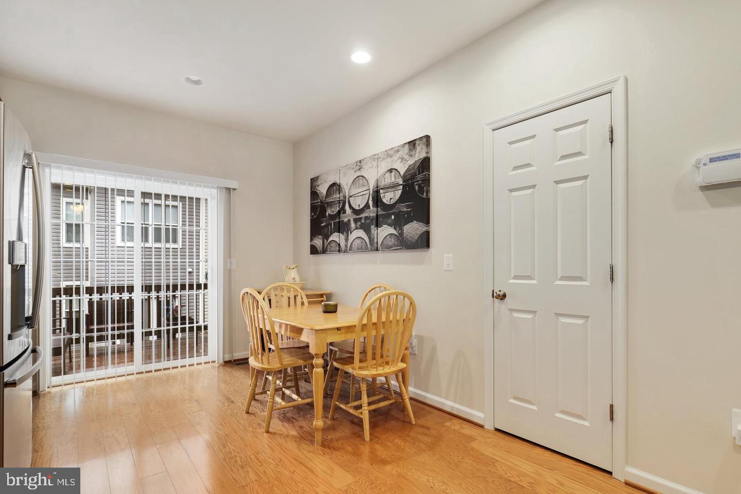 205 Woodstream Circle, Unit 2984 Stafford, VA 22556 - Photo 8 of 21 a dining room with furniture and wooden floor
