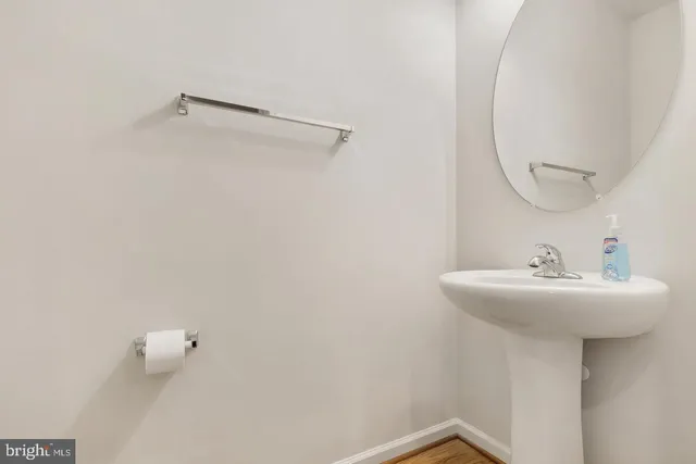 a bathroom with a sink and mirror