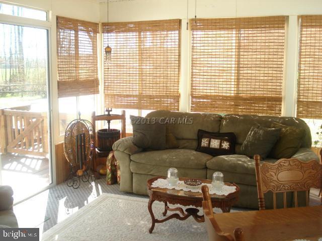 8037 Downs Road Newark, MD 21841 - Photo 16 of 23 a living room with furniture and a large window